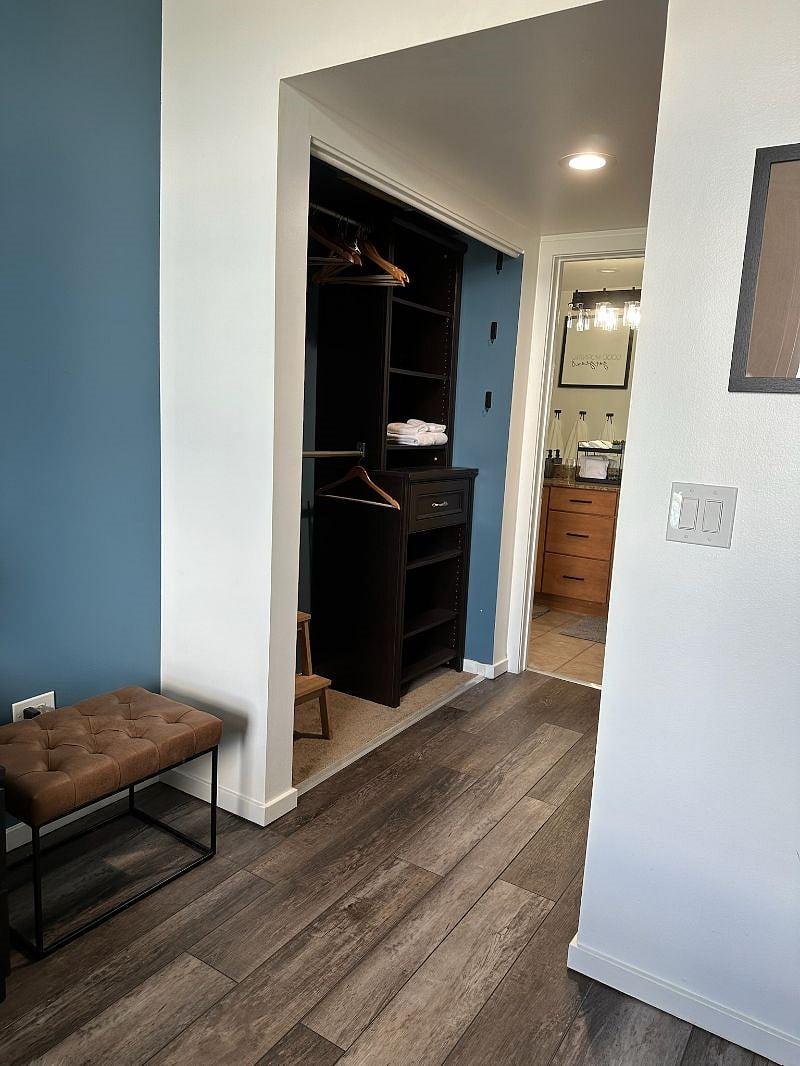 Walk through his and hers closet on each side of the hall.