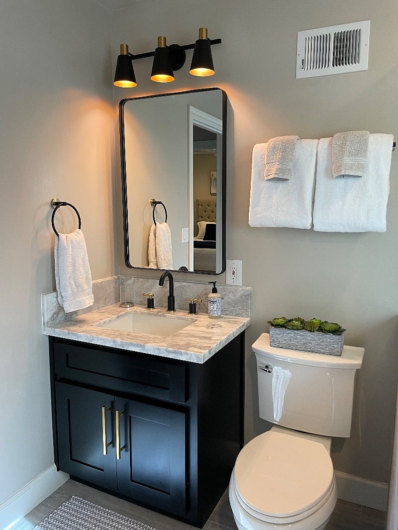 Luxury marble countertop and storage under the sink.