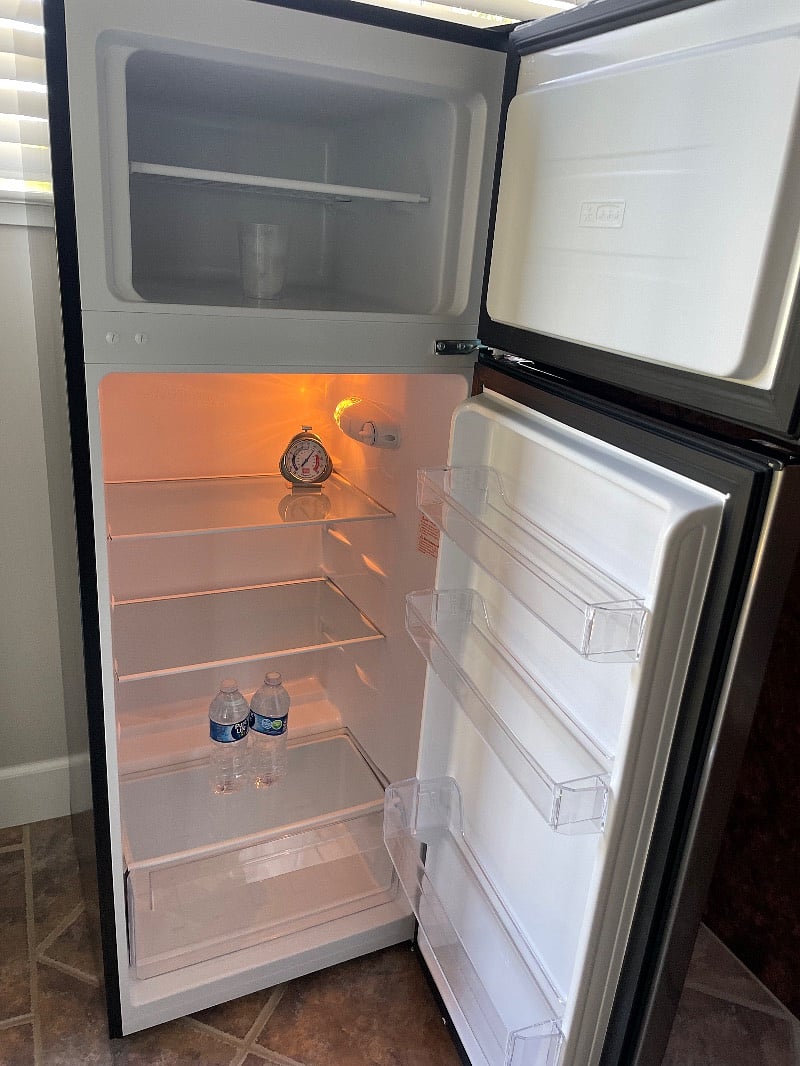 Medium size refrigerator and
a mini built in refrigerator in the bar/kitchen area
