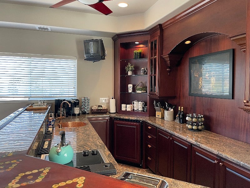 Full kitchen with stove, oven, microwave, ice maker, two refrigerators (one mini an one medium size) Pots, pans, dishes, etc.