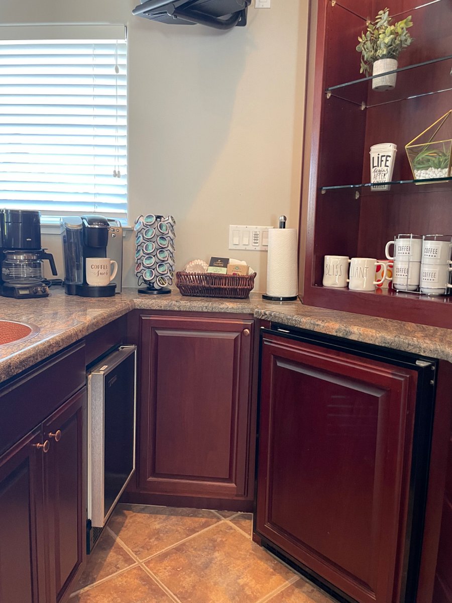 Mini fridge and ice maker built in to the cabinet. A regular pot and a Keurig are available for your use.