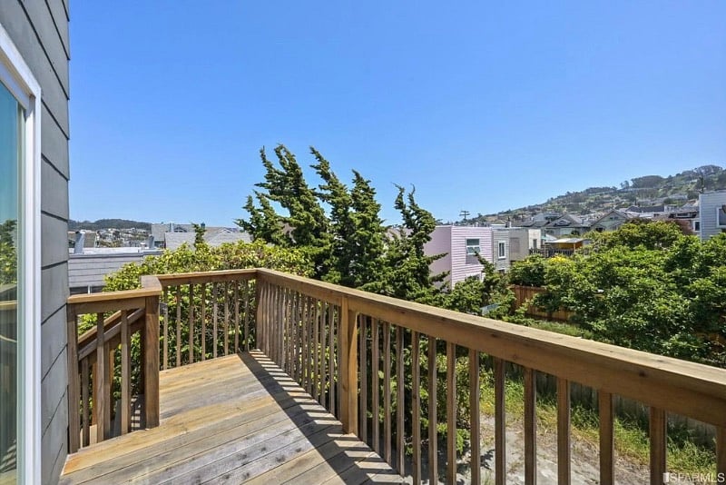 Deck leading from the bonus room to the backyard