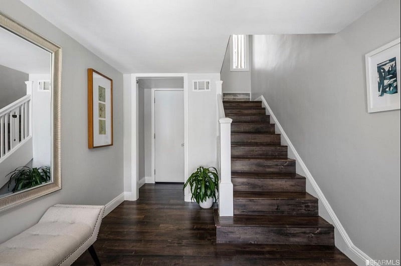 First floor landing upon entering the unit, which leads to the second floor