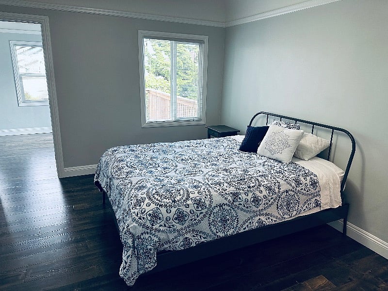 Bedroom 1 with bonus sunroom/office with access to the backyard