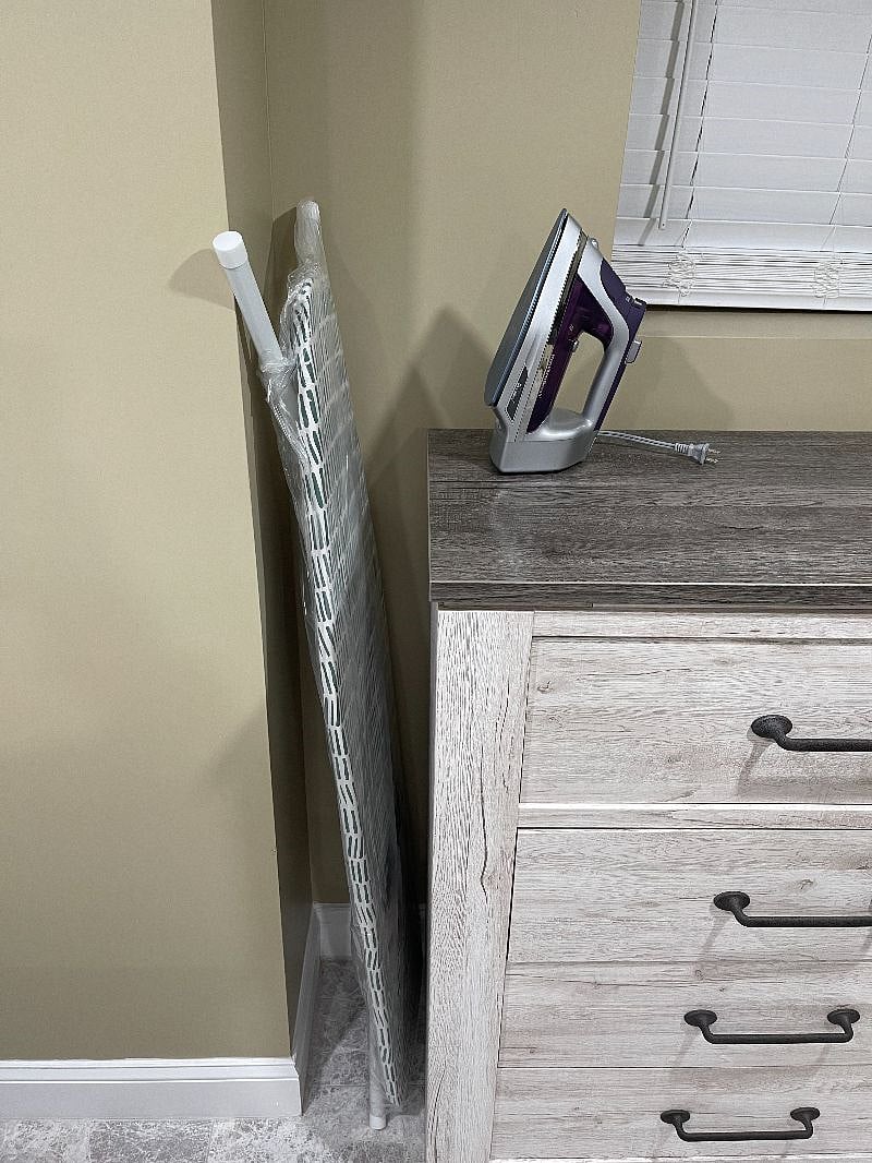 Keep your clothes wrinkle-free with the provided iron and ironing board.