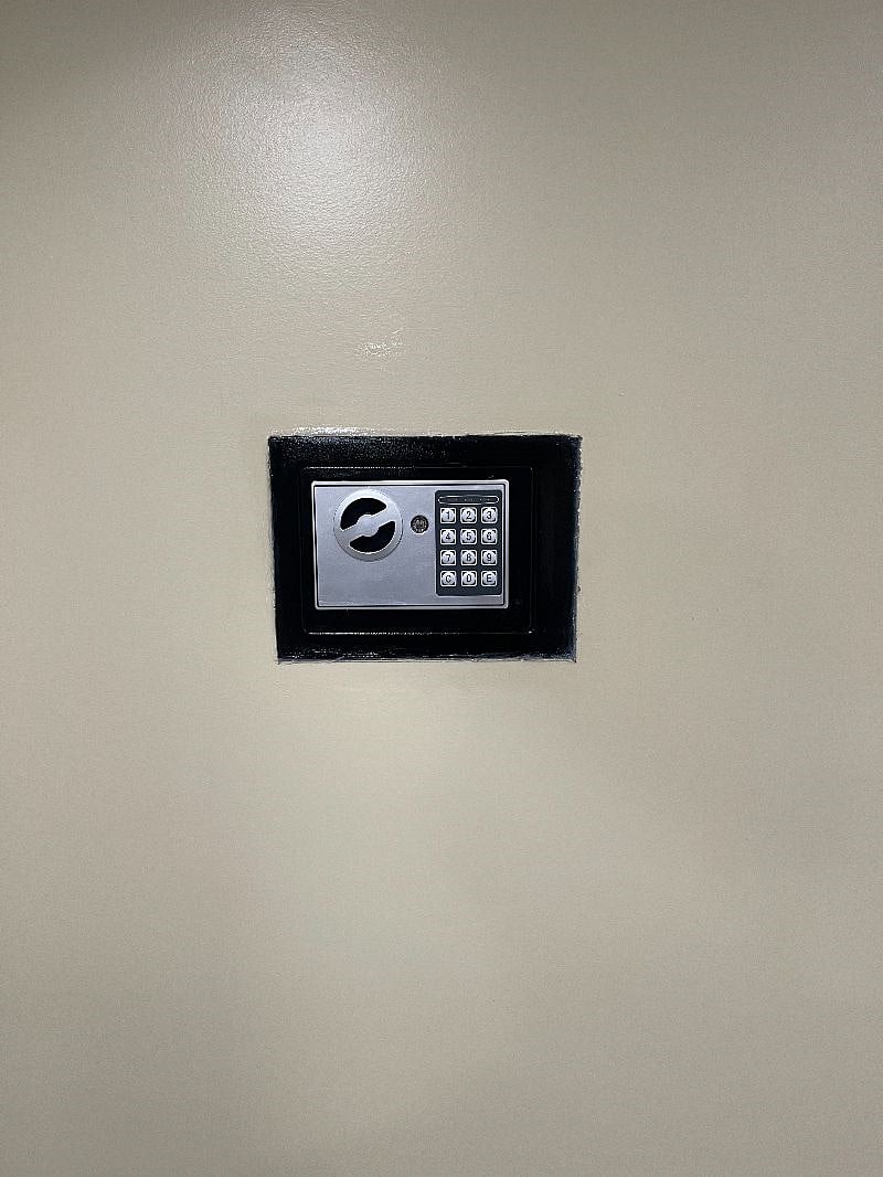 Secure your valuables with the provided safe deposit box.