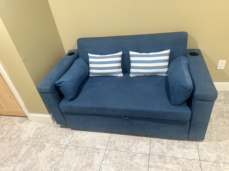 Relax on the living room couch or convert the sofa into a bed for extra sleeping space.