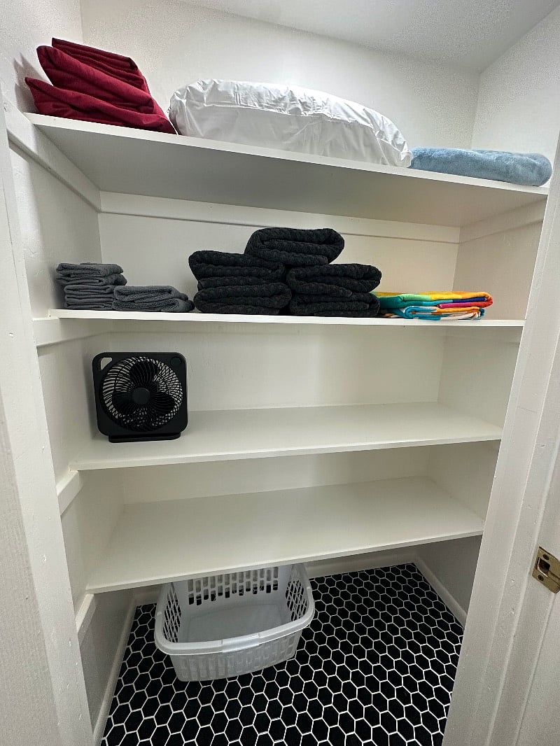 Extra linens and fan, plenty of storage