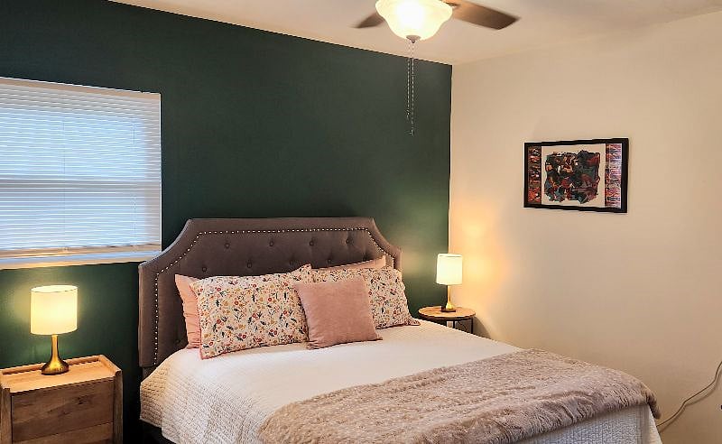 Comfortable bedroom with queen bed, quality linens, and plenty of storage.
