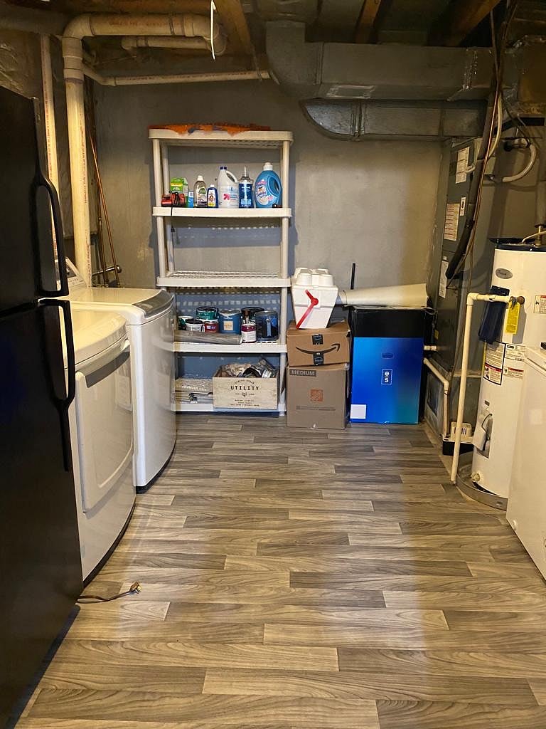 Laundry Room with in unit washer/dryer and Fridge 