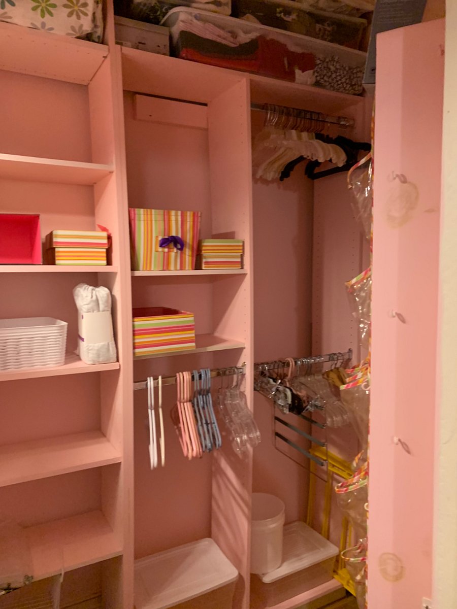 Walk-in closet with hangers and organizers (Owners off-season clothing will remain on top shelves in plastic containers.)