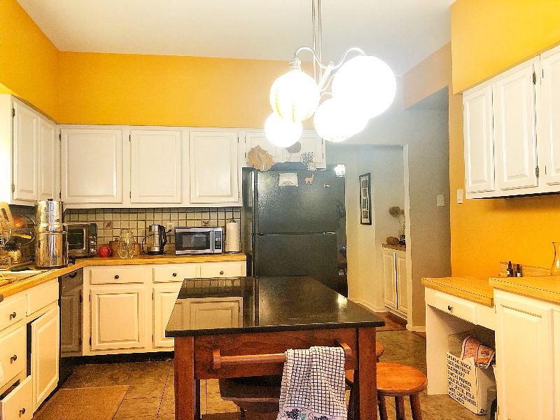 Kitchen has tons of storage, microwave, water filter, air fryer, water heater, etc. 
