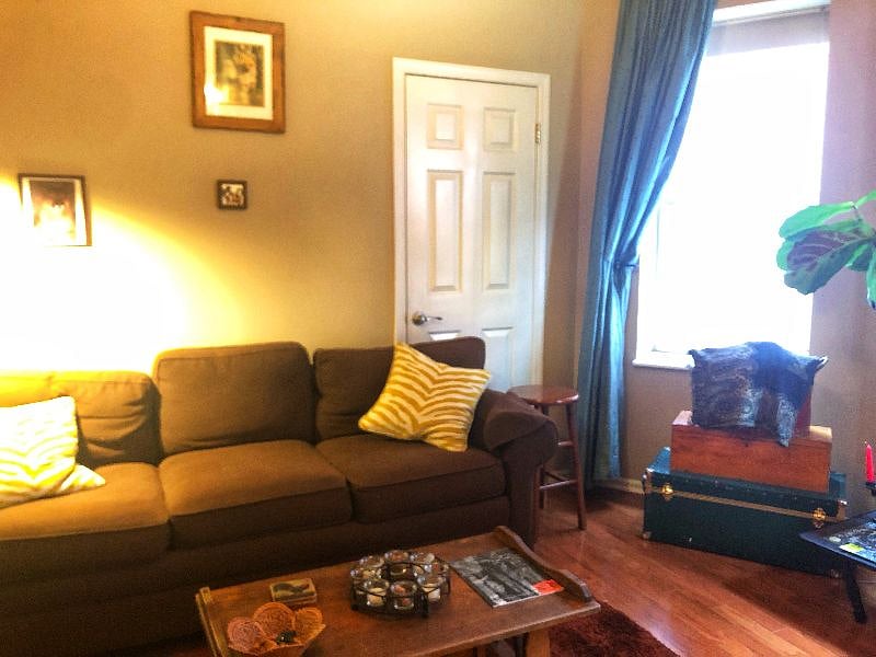 View of couch from den. Room also has a wet bar. 