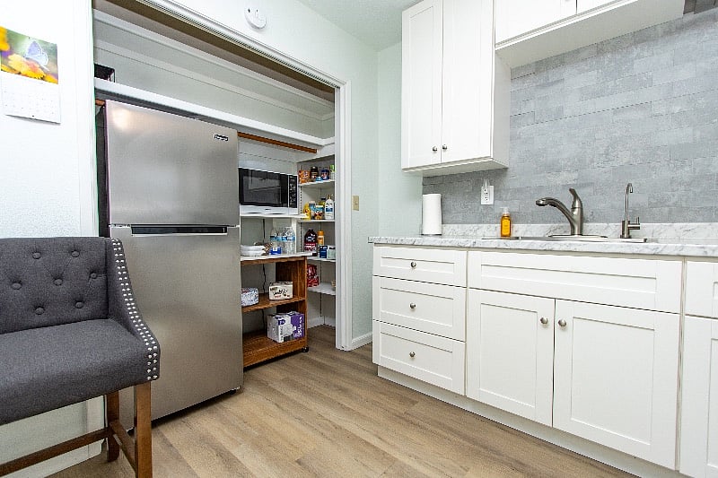 Kitchen.. refrigerator, microwave and pantry.