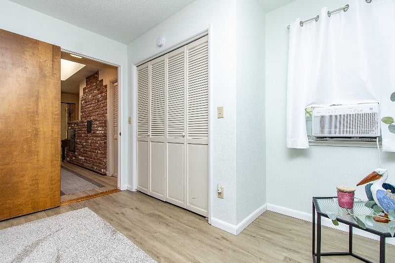 Bedroom with closet and looking down the hall