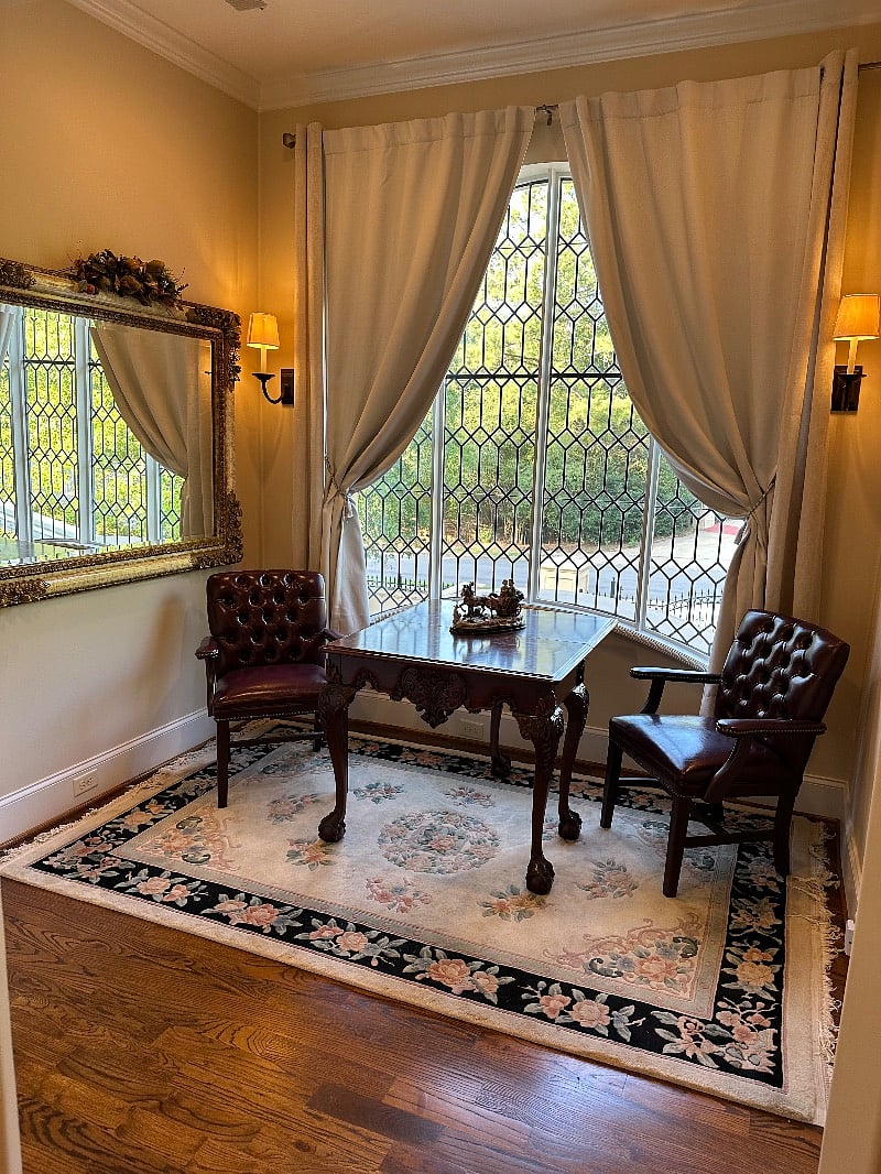 Elegant private study area with expandable table doubles as sit down eating area.