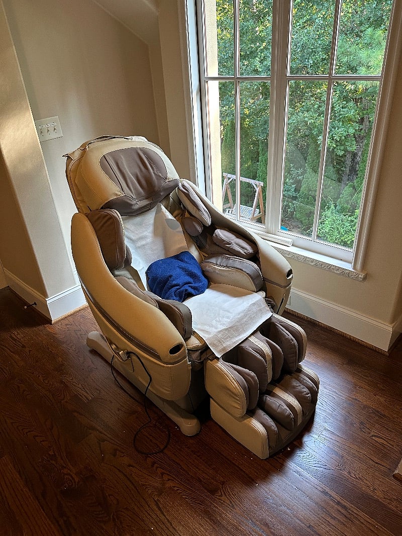 The leatherette on this perfectly functioning massage chair is well worn, but it does wonders to help you relax and relieve muscle aches. 