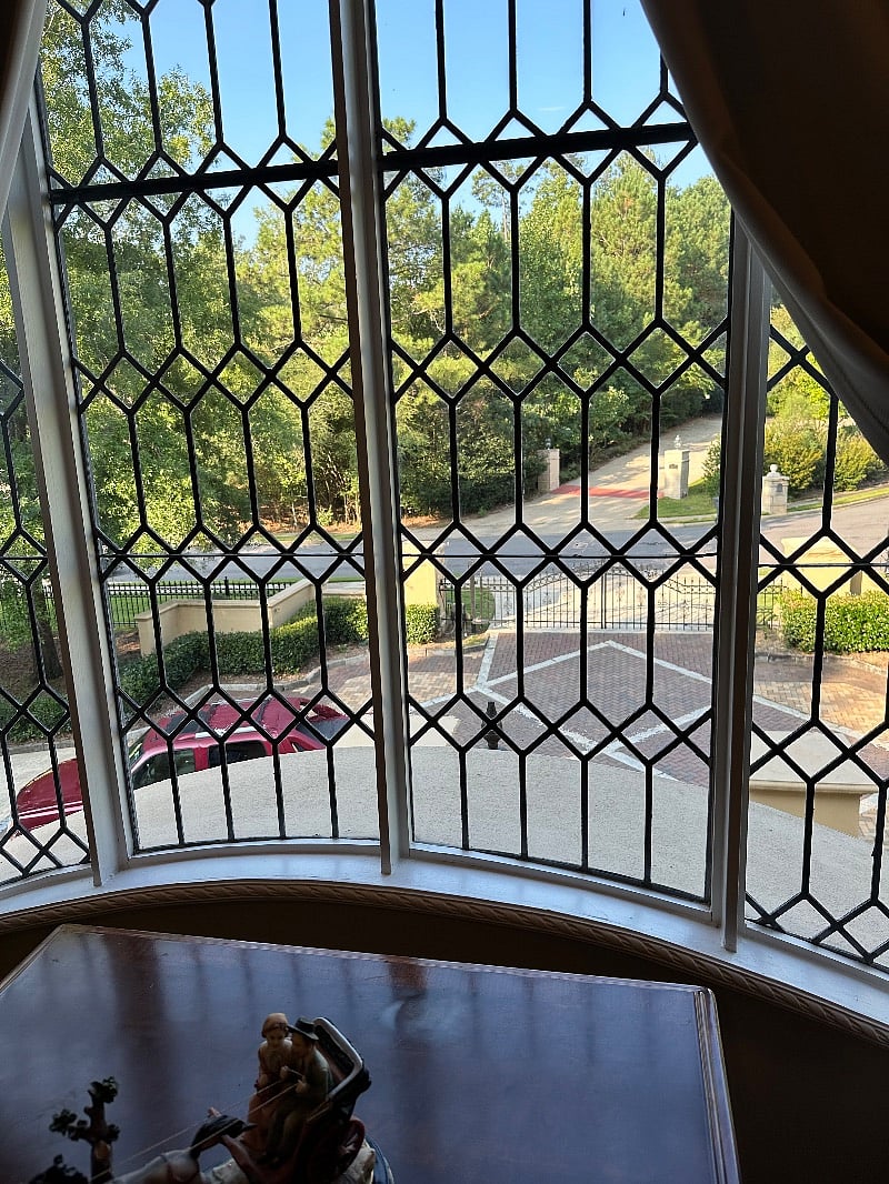 My favorite window overlooks the gated entrance and those who drive by to admire this highly desirable property.
