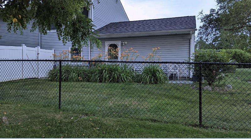 This is a side view of your apartment that starts from the fence and goes all the way to the right That is your private entrance