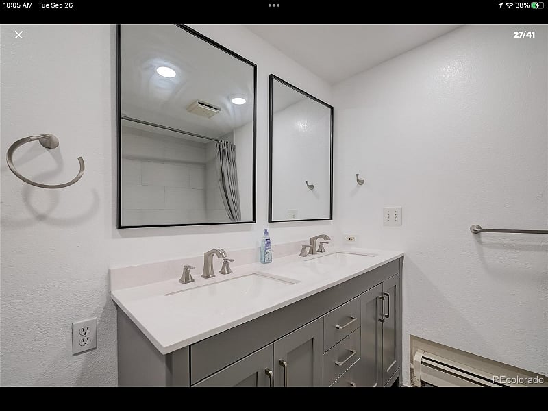 Downstairs bath with double sinks and bathtub