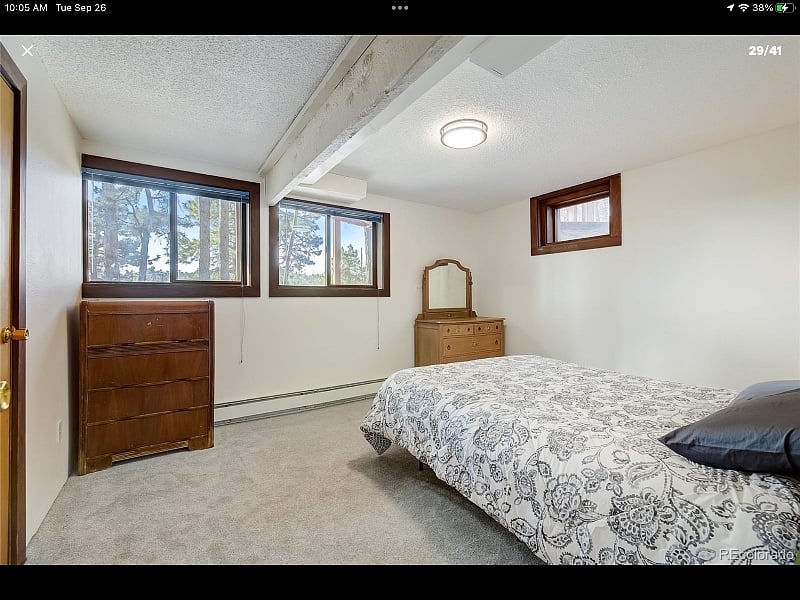 Downstairs-
one of two bedrooms with a queen bed and dresser