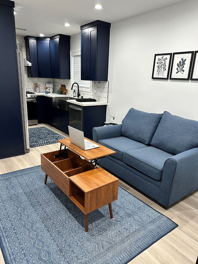 Console table transition to desktop workspace in living room.