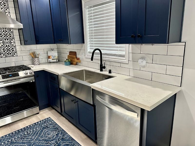 Kitchen view. Gas stove. Dishwasher.  New refrigerator. Microwave. 