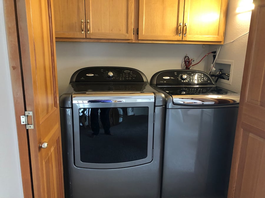 Shared washer/dryer in loft outside bedroom 