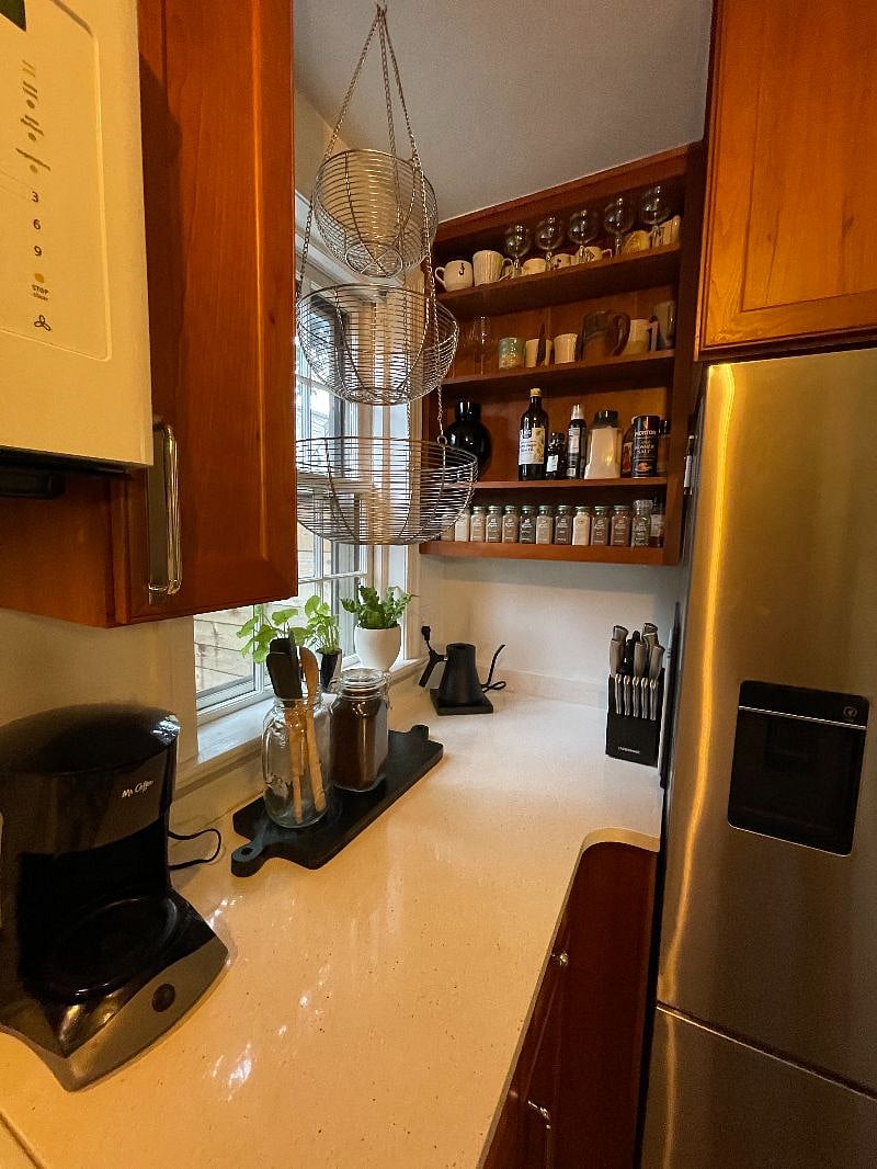 Kitchen shelving & window to back yard