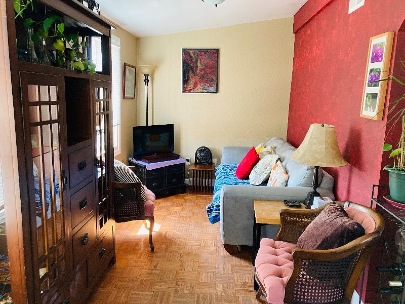 Living room & hang out space: tv, games, extra pillows, view of trees 