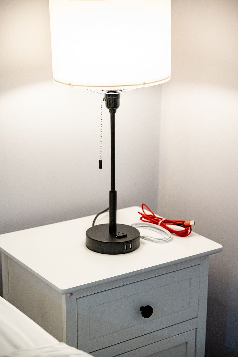 Our bedroom also features lamps with USB outlets and extra charging cords to cater to your electronic needs.