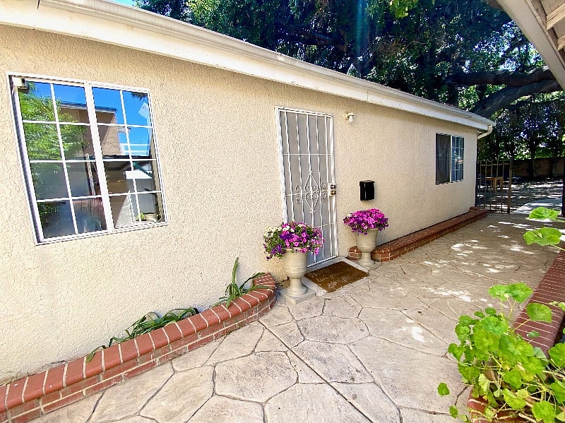 Private entrance to the furnished three-bedroom apartment.