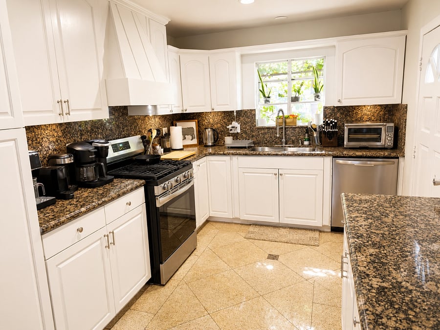 Shared kitchen easily accessible in an attached neighboring unit.