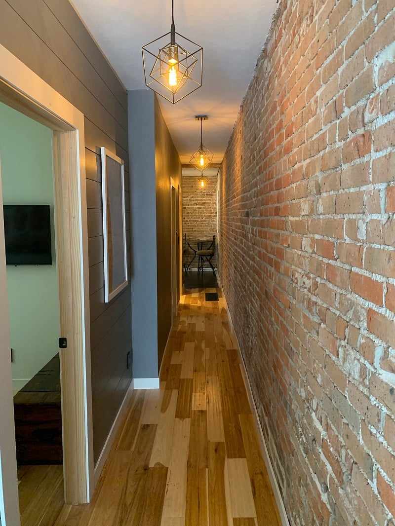 Hallway looking toward the kitchen. Bedrooms and bathroom are on the left.