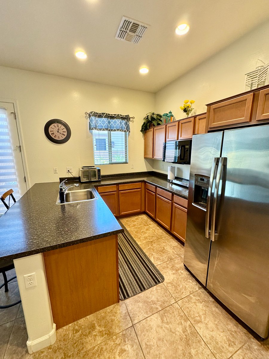 Spacious kitchen with all cooking utensils.