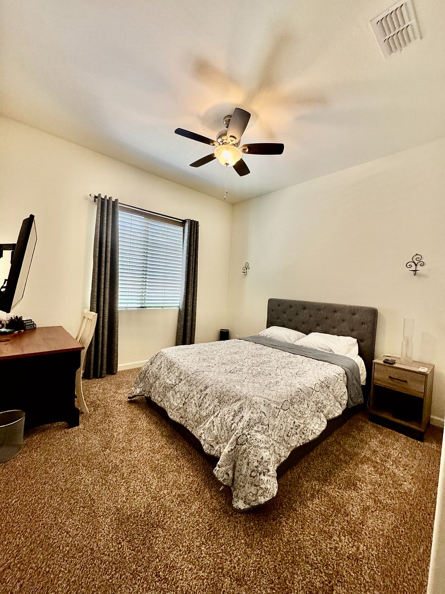 Bedroom with blackout curtains. Many compliments on how comfortable the bed is. 