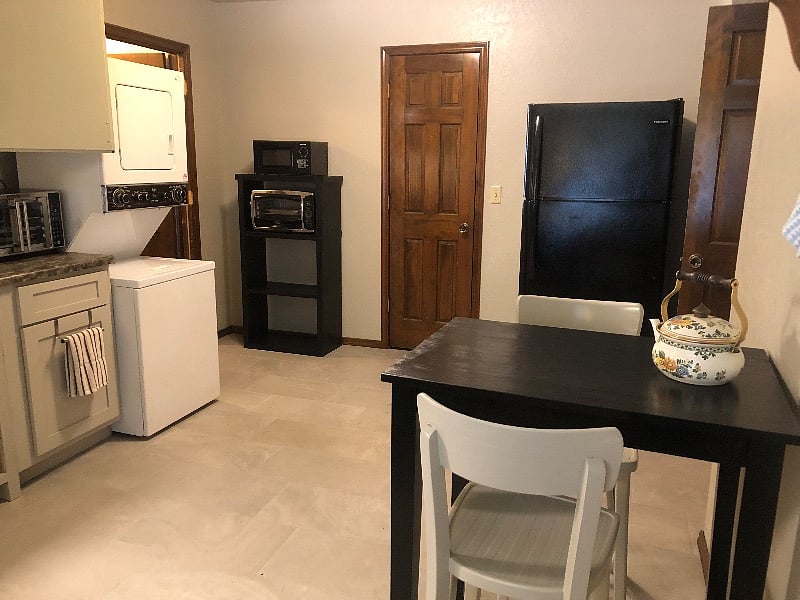 Kitchen has full sized refrigerator.