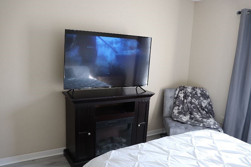 Master bedroom with electric fireplace
