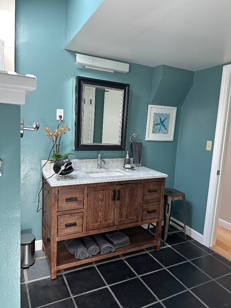 Oversize bathroom with skylight and storage.