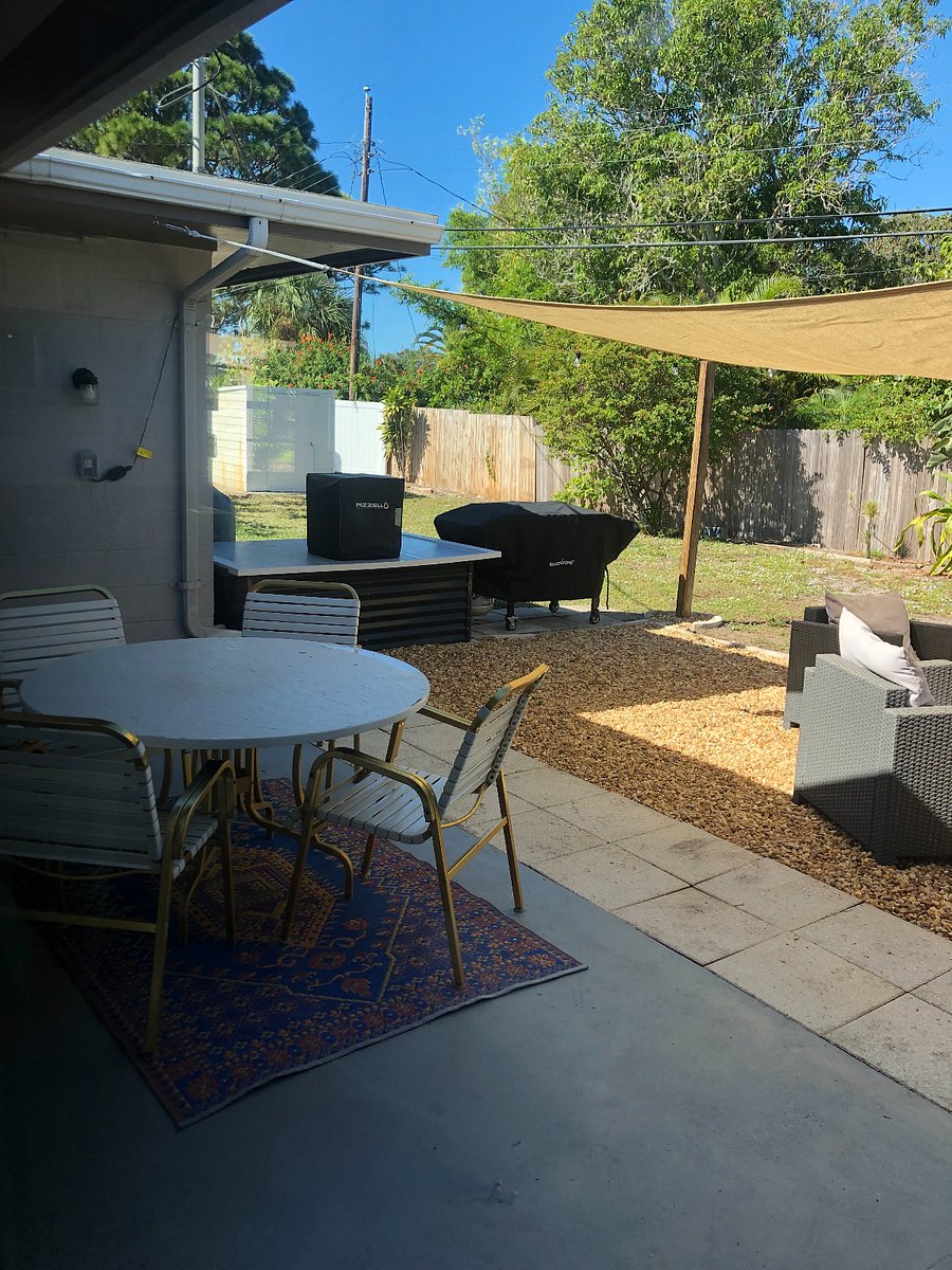 Outdoor cooking station features Blackstone Griddle, propane grill and wood burning pizza oven!