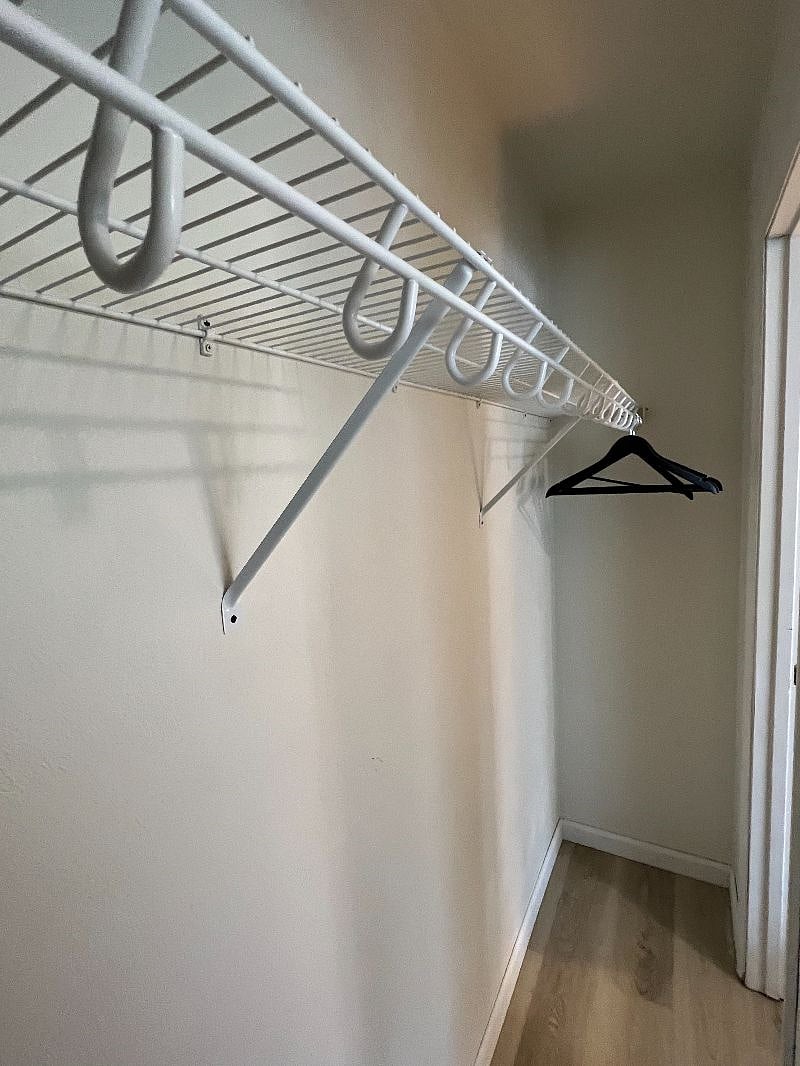 Bedroom 1 - Full bed, closet, vanity, large window, two side tables
