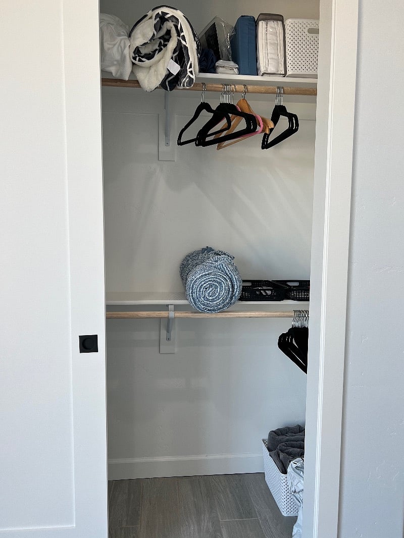 closet door opened where beach towels, extra linen etc are stored and still room for your belongings