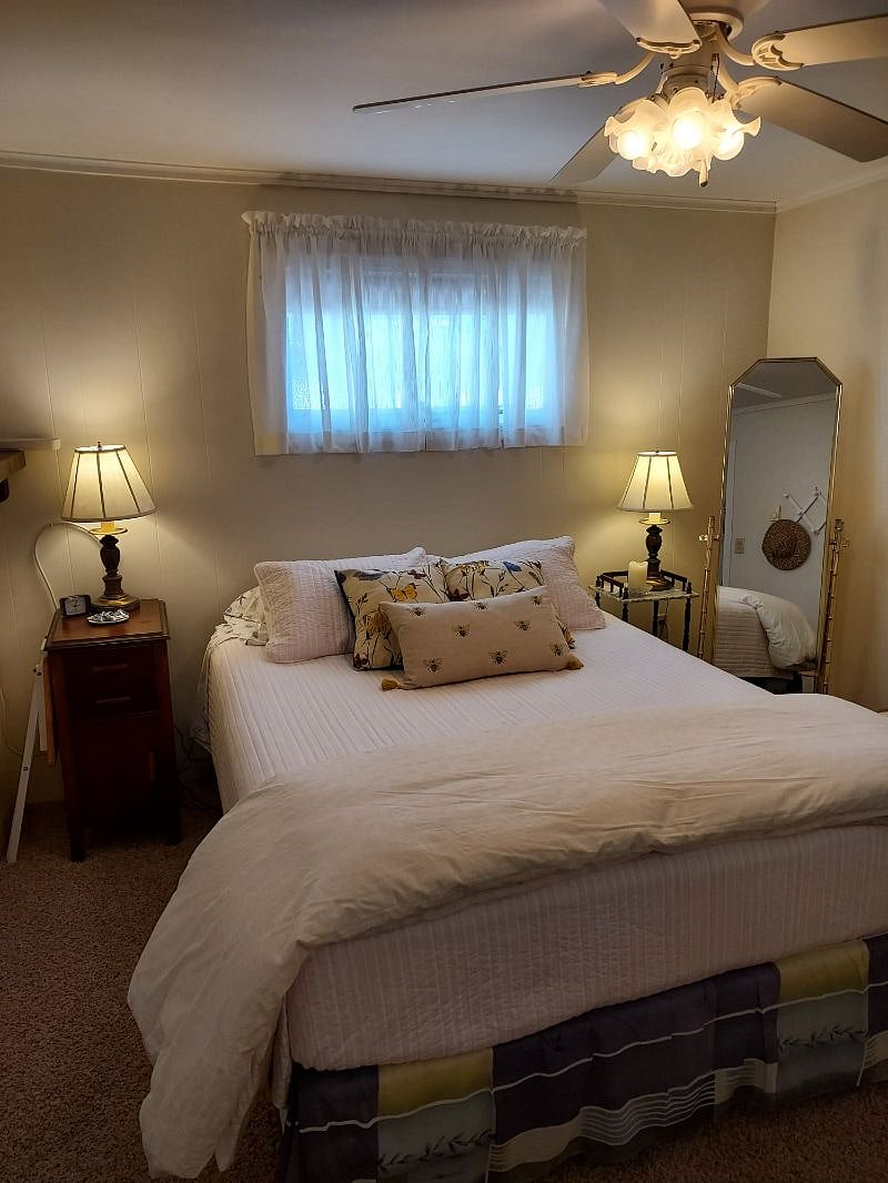 There are 2 bedrooms. This one is called The Butterfly Room. Queen bed. One window.