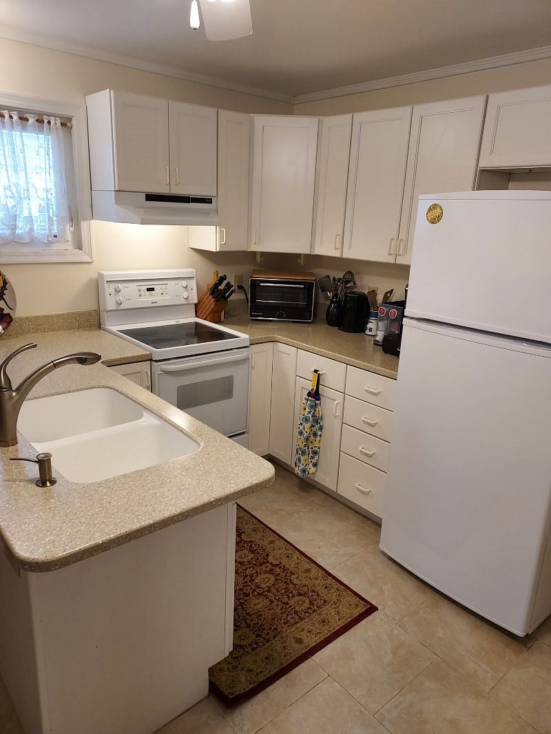The kitchen is fully stocked for cooking.