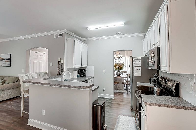 fully equipped kitchen with stainless appliances.