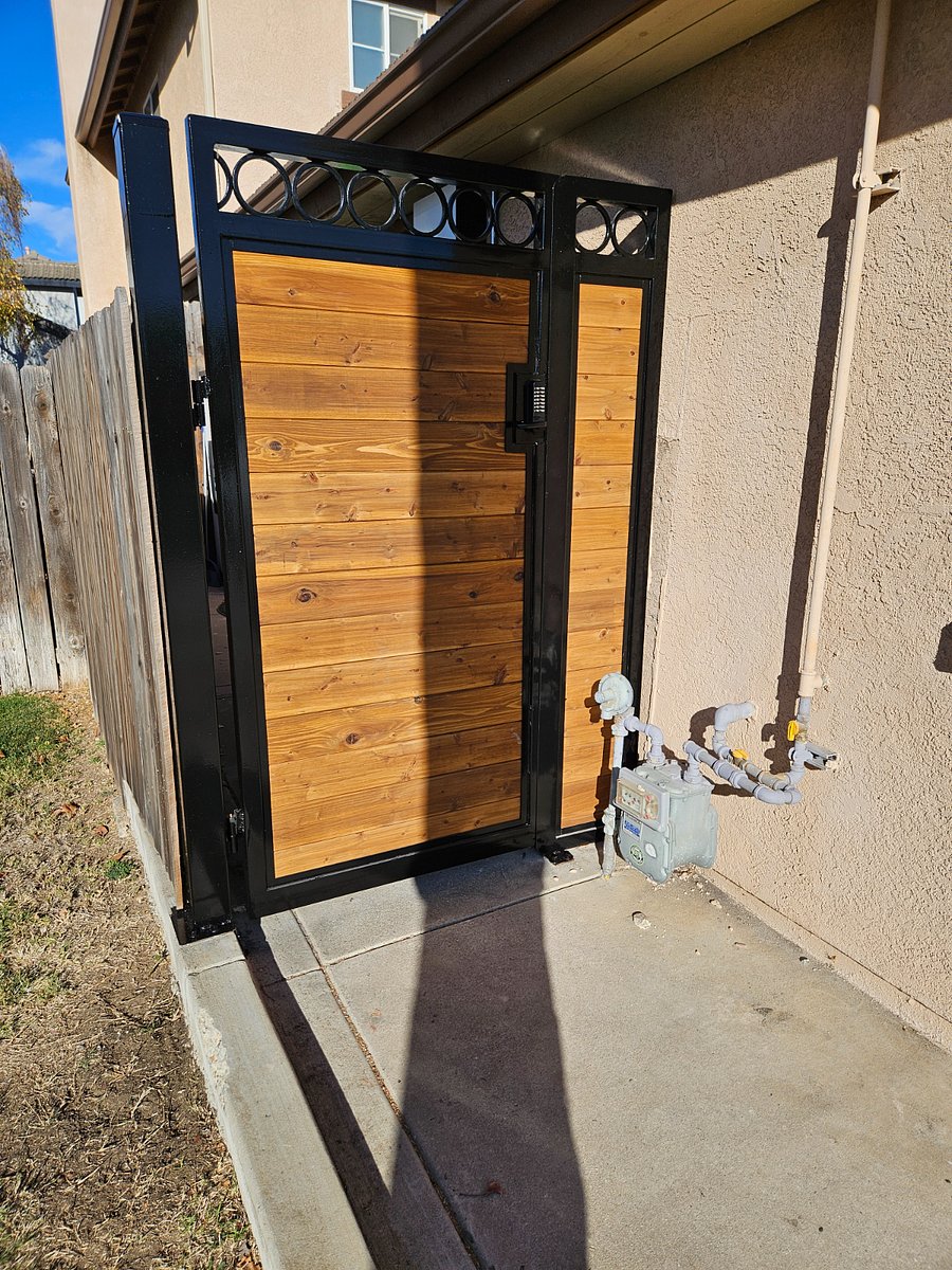 Separate entrance with metal gate and combination lock.