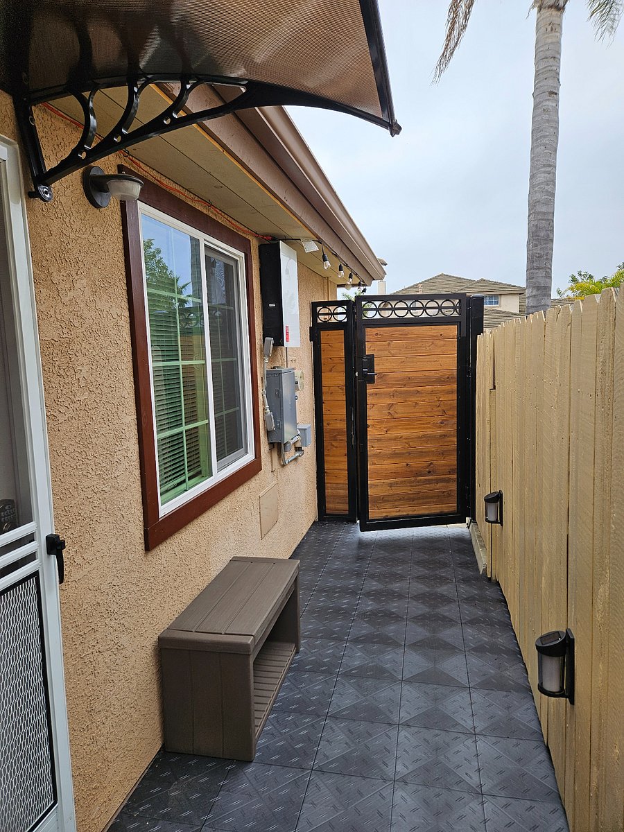 Metal gate with deadbolt lock for added security.