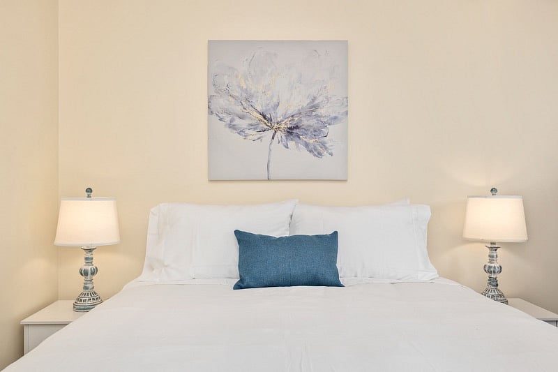 Bedroom area with queen bed.