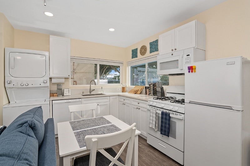 This studio kitchen is fully equipped: dishwasher, Washer/dryer; stove, refrigerator, and microwave..poots, pans and utensils