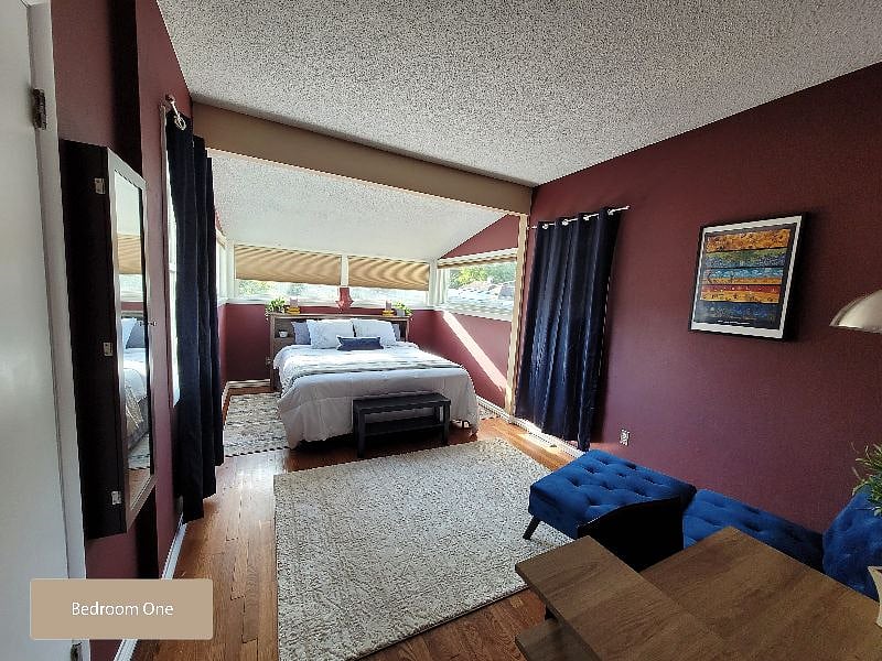 Bedroom One - California King with enough open floor space for working out or yoga! Scenic window views!